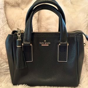 Kate Spade mini tassel handbag purse. Black Leather with gold tone metal.
